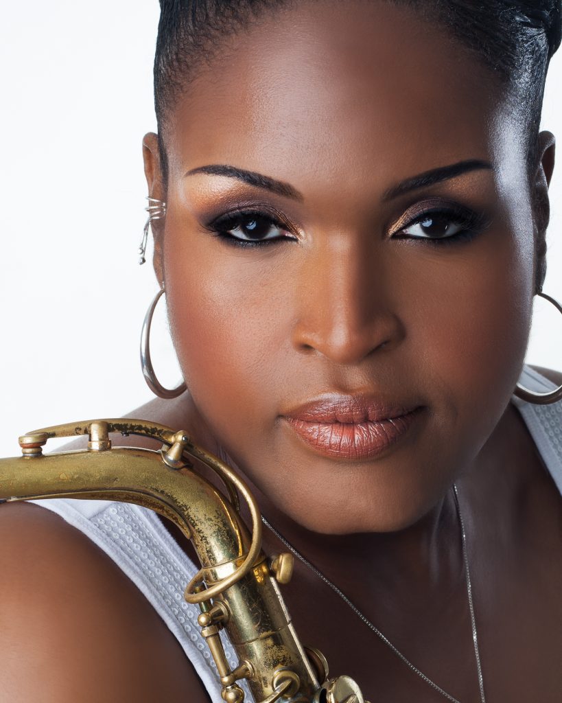 Stephanie Sanders Headshot with saxophone